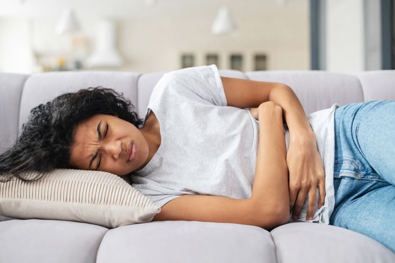 African American woman suffering from cramps